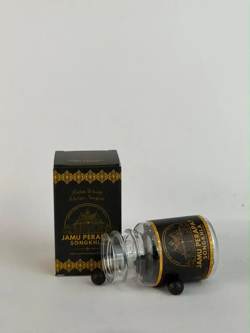 Botol dan kotak Jamu Songkhla dengan pembungkusan hitam dan emas